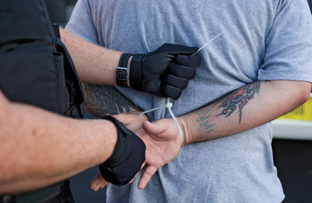 Police wearing patrol glove on duty